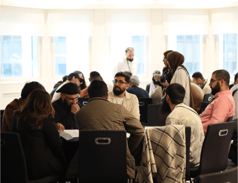 Image of groups of people at a roundtable